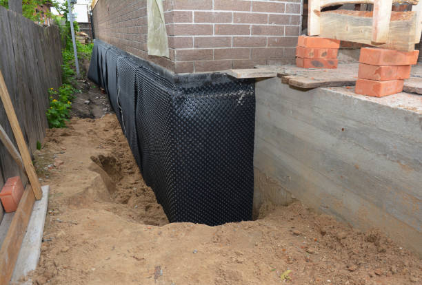 SJ Waterproofing Pros technician performing targeted Waterproofing assessment in Cedar Bluff, VA